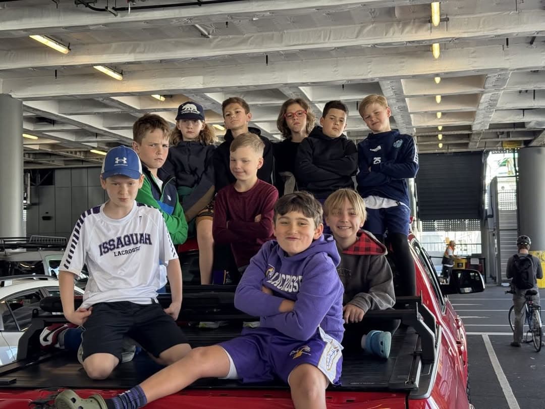 Issaquah 3/4 White teammates together on a ferry trip to their Bainbridge game.