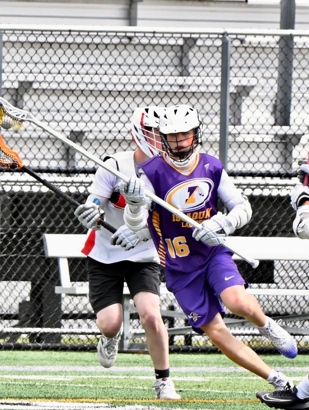 An Issaquah 7/8 player running with his stick during a game.